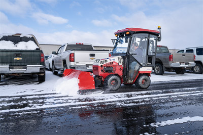 Ventrac Box Blade - Ventrac Box blade pushing snow away from vehicles.