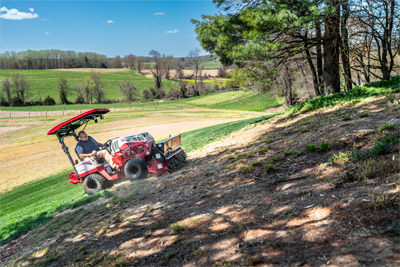 Ventrac Aera-Vator - The Ventrac effortlessly operates on slopes with the Aera-Vator attachment, seeding damaged areas of the lawn for revitalization.
