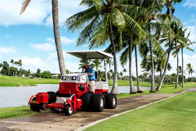 Ventrac Edger - An optional addition of a blower makes it so the operator can edge and clear path of grass and dirt all in one pass. 