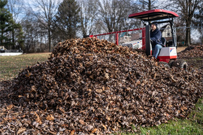 Ventrac Leaf Plow - The Leaf Plow can be mounted on the front or the back of the tractor to assist in moving massive piles of leaves for easy removal.