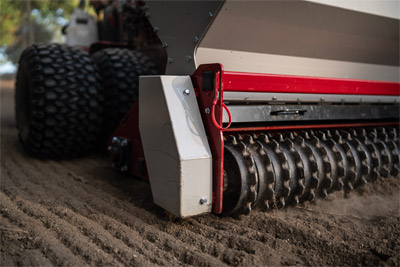 Ventrac Primary Seeder - The Front Packer Roller crushes the material to provide a smooth surface for the seed to drop. The Rear Packer Roller is an offset roller that places a fine layer of dirt over the seed.