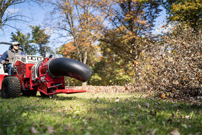 Ventrac Turbine Blower - The Ventrac 4520 using the Turbine Blower clears leaves fast and efficient thanks to adjustable direction and wind speeds of 170 mph.