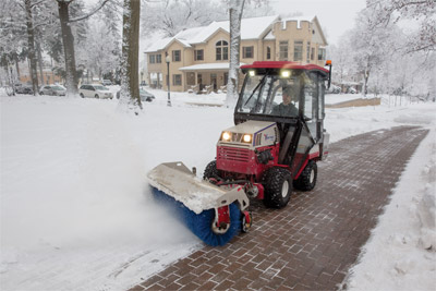 Ventrac 4500Z using Power Broom for Snow - The Power Broom gets right down to the pavement level in a way that blades cannot for a more complete snow removal, ideal for campus grounds management.