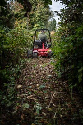 Ventrac Tough Cut - The Tough Cut clears a path to reclaim a wooded area back to a usable yard.
