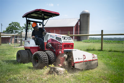Ventrac Stump Grinding - Ventrac 4520 with duals and a canopy removing a small stump.