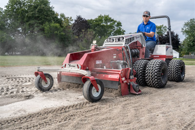 Ventrac Power Rake - The Ventrac Power Rake being used to regrade a baseball field to be put back into use.