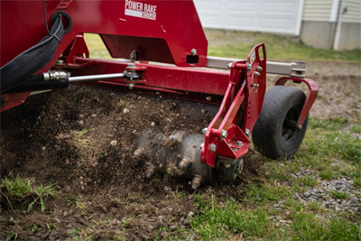 Ventrac Power Rake - The carbide tips of the Ventrac KG540 Power Rake rejuvenate a gravel driveway by bringing old gravel back to the surface and removing unwanted weeds. This robust machine, equipped with seventy-two replaceable carbide tips and hydraulic height adjustment, excels at refreshing gravel driveways and creating a pristine finish.