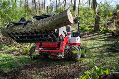 Loader with Rock Bucket - Navigate uneven terrain when working a tree removal job.