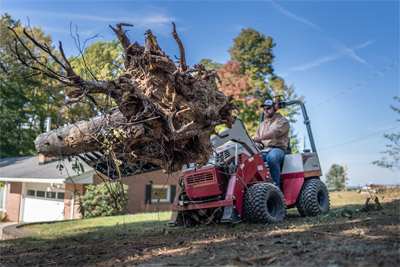 Ventrac Rock Bucket w/ Grapple - Remove dead tree limbs from work sites without sacrificing your time.