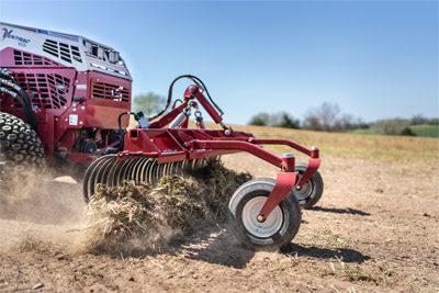 Ventrac Landscape Terra Rake - 4520 tractor with Landscape Rake pushing debris off topsoil for a proper lawn installation.
