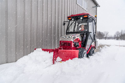 Ventrac V-Blade - Enjoy the comfort of a warm cab while the Ventrac V-Blade does the hard work.