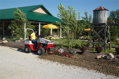 Ventrac 4500 and Trencher - The KY400 attached to a VENTRAC 4000 Series tractor gives the operator the ability to maneuver into hard-to-reach locations without damaging the turf like a traditional track unit would.