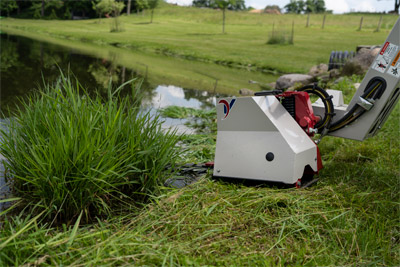 Ventrac Boom Mower - Cut back unwanted growth in lakes and ponds.