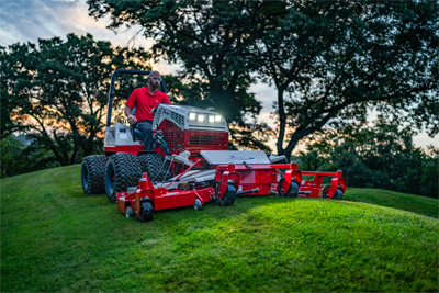 Ventrac Contour Mower - The Ventrac Contour Mower tackles a hillside with ease, as its independent decks float and hug the terrain on both sides. With an 83-inch working width and 40 degrees of motion, it delivers a precise, even cut on sloped surfaces, ensuring a well-maintained finish.