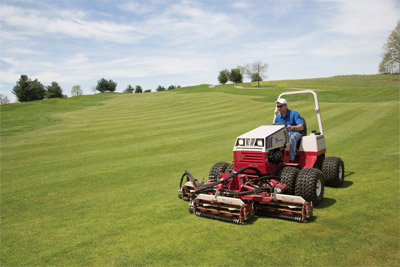 Ventrac 4500 with Optional Dual Wheels using Reel Mower - The Ventrac MR740 Triplex Reel Mower is designed to be the ultimate trim and surround mower with a 74" width of cut, variable speed hydraulics, standard back lapping valves, and offset capability.
