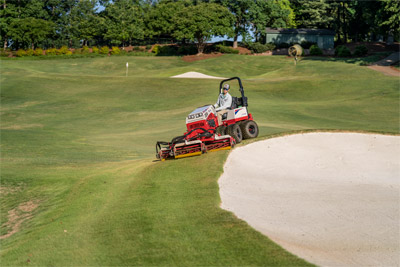 Ventrac Reel Mower - Shown with optional dual wheels the AWD 4520 can maneuver more places and, together with the front-mounted Reel Mower, can reduce the amount of hand work needed to maintain professional turf areas. 