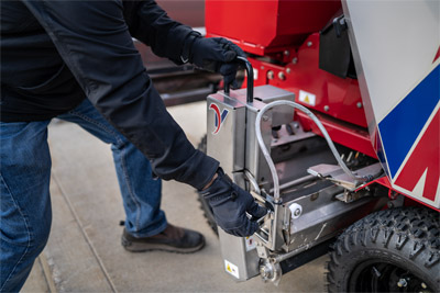 Ventrac SSV Drop Spreader - A slide out hopper makes it easy for an operator to refill the bin and keep moving on the job.