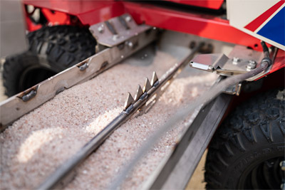 Ventrac SSV Drop Spreader - A bag opener welded in the bin makes refill quick and easy.
