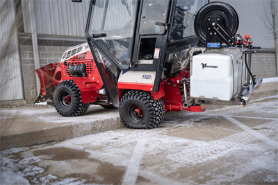 Ventrac Brine Kit - Maneuver on and off curbs with ease. The FlexFrame on the Ventrac 4520 ensures smooth navigation and thorough de-icing even where ramps are absent. The versatile 5' spray wand and optional 25' hose reel on the Brine Kit further enhance its reach and effectiveness.