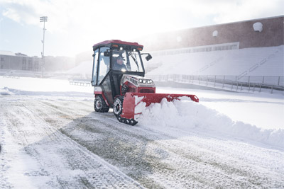 SP720 Box Plow - The Ventrac Box Plow being used to clear snow from turf. The light footprint allows the tractor to work on turf without causing damage.