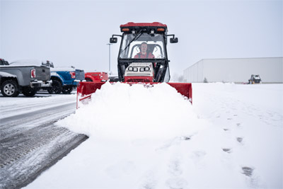 Ventrac Box Plow - The compact design of the Ventrac 4520 equipped with the Box Plow and precision make maneuvering through tight parking lots a breeze, ensuring uninterrupted business operations.
