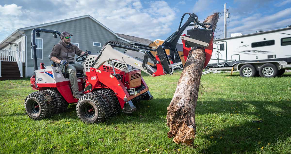 KM500 Loader equipped with KM300 Log Grapple