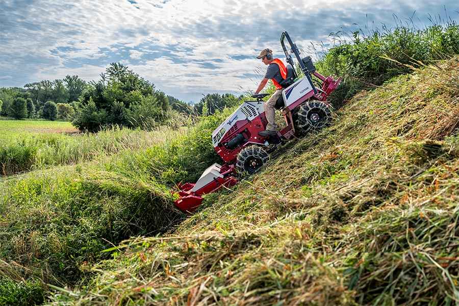 Ventrac 4520 tractor mowing on a sloped hill